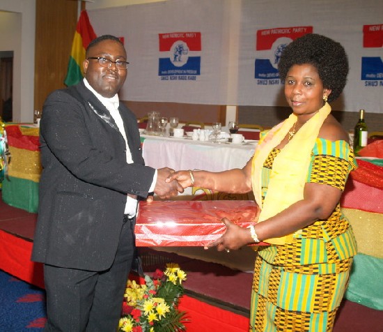 A raffle winner (left) being presented with his award