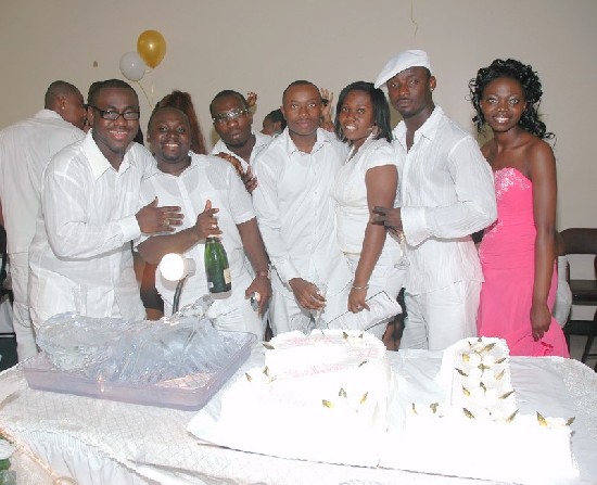 Ellen (far right) and friends posing infront of the birthday cake