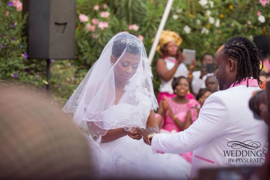 Selly putting the ring on Cartel's finger