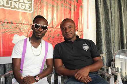 Okyeame Kwame and Kwame Fakye pose for a photo at the event.