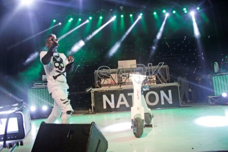 Shatta Wale on stage with the scooter