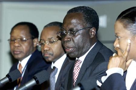 African finance ministers meet reporters at the International Monetary Fund in Washington Saturday, April 20, 2002. From left are, Central Bank of Tanzania Governor Daudi Ballali, Ghana Finance Minister Yaw Osafo-Maafo, Congo Central Bank Governor Jean-Cl