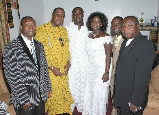 The couple in a pose with the men of God