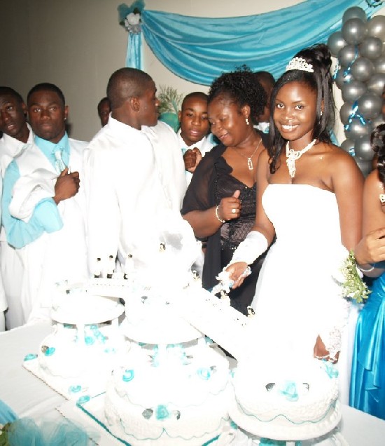 CLOSE UP - Pauline smiles as she cuts her birthday cake