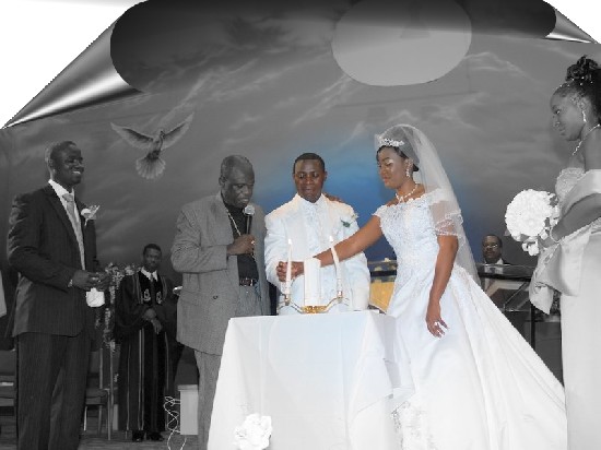 The couple lit their candles together and assisted by Bishop Owusu Ansah (second left).