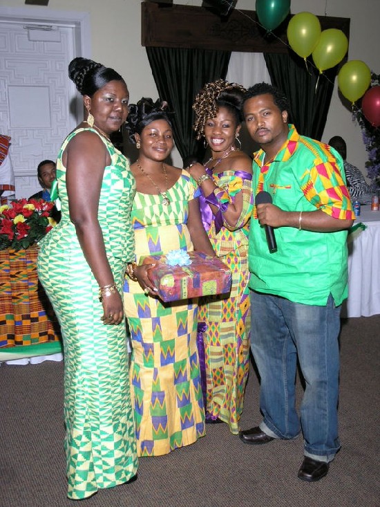 Yacob Amare posing with finalists of the Best Hairdo finalists. Winner
was; Janet Boakye (The MCs lady, second left with parcel)