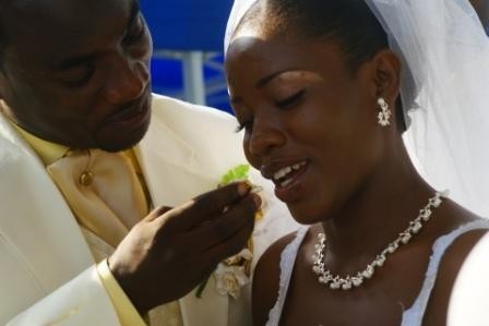 The bride and groom exchange bites