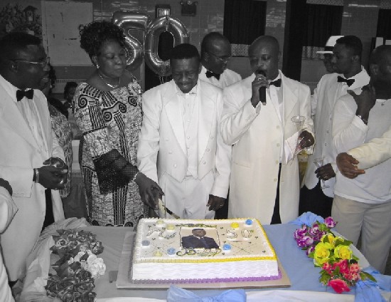 Mathias offering his wife a piece of the birthday cake