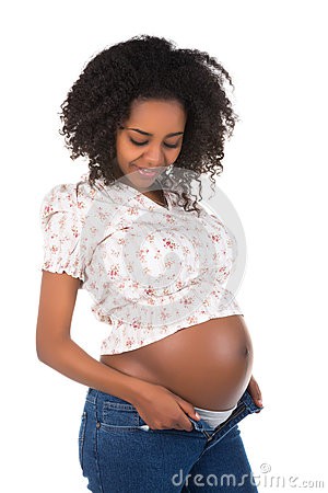 pregnant woman in a jeans and crop top