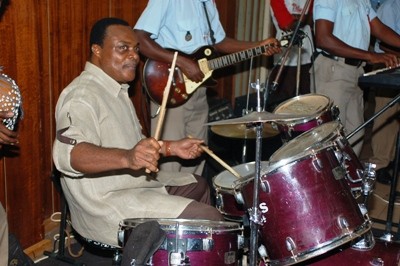 Health Minister, Maj. (rtd) Courage Quarshigah was recently spotted behind the drums set during a ceremony to honour the crew of the 'Mercy Ship', which docked in Accra