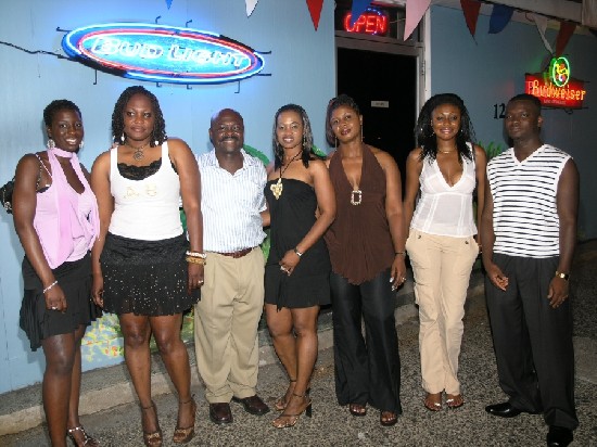 Kwasi Agyenim Boateng, Manager/Proprietor (middle)posed with some of the pretty ladies of the evening.