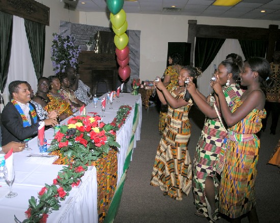 fans taking pictures of Van Vicker (right) as he got seated