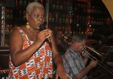 African American Toni Manieson sings at the Jazztone bar in Accra November 18, 2006. In African dress and with dyed-blond cropped hair, she croons and sways in the bar she owns in the town she has made her home: Jazztone in Accra, the sweaty oceanside capital of the West African country of Ghana.