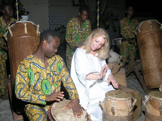 Ms Paolo learns some skills in playing the drum