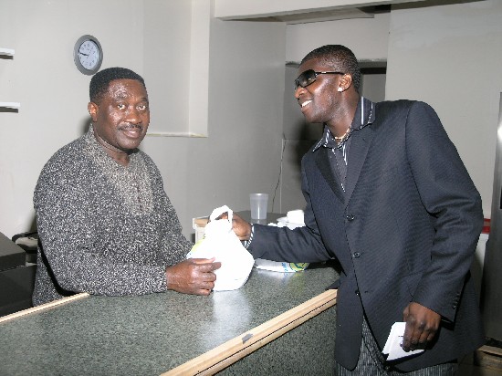 Papa Linc gets a take-away from Mr. Osei Bonsu