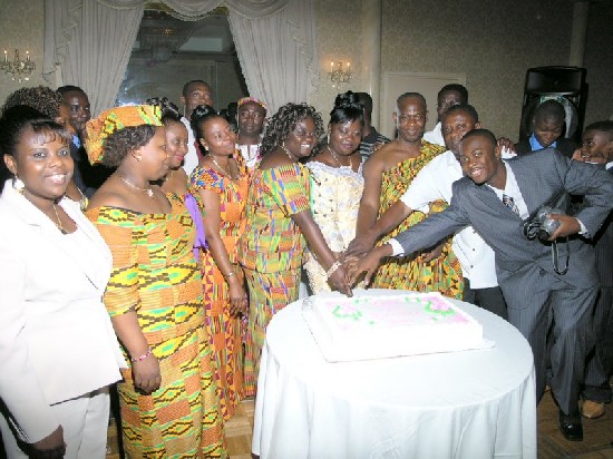 She is supported by her family in cutting her birthday cake