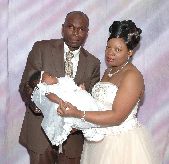 Parents pose with their bundle of Joy