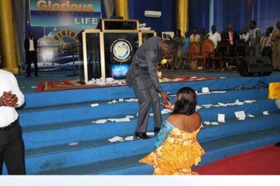 Prophet Emmanuel Badu Kobi handing over the key to her