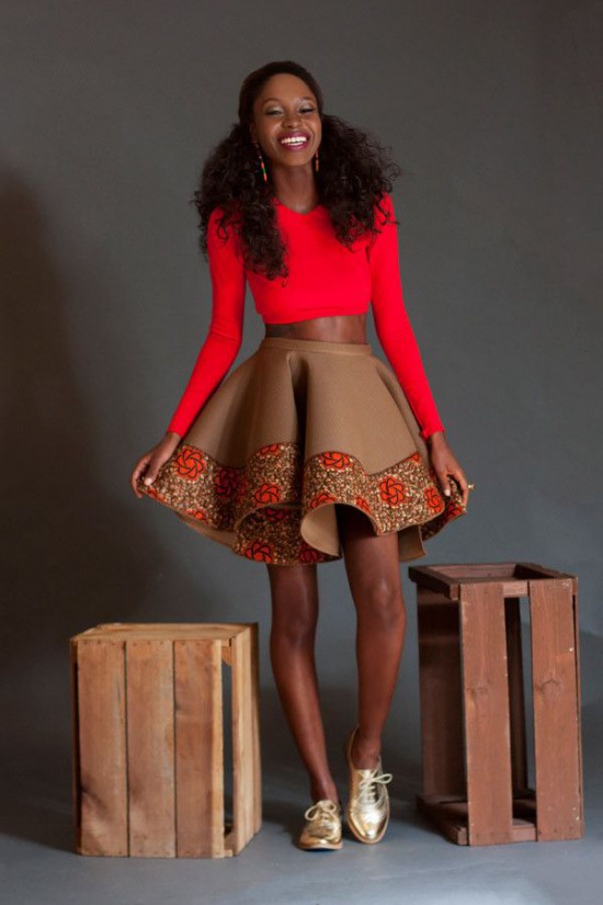 This Gold derby shoe is paired with a long sleeved V-neck red crop top, paired with a brown flared faux leather skirt with Ankara print detailing.