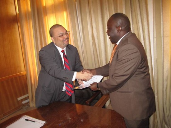 Mr Shariman Zainal Abidin handing over the document to Mr Baba Jamal, Deputy Minister of Information after the signing ceremony.