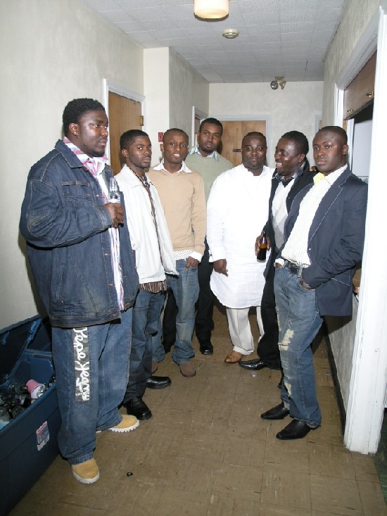 A group posed with Costello including Kwame Barnieh, Accounting genius (far right and with hands in pocket) and Owura, Bensalem's finest and part of the Ohemaa magazine's team (third from left)