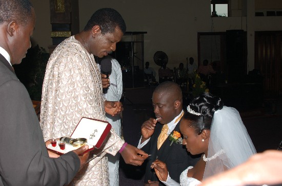 Rev. Dr. Mensah Otabil offers communion to the new couple