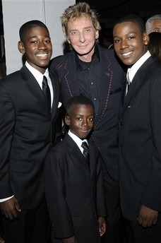 Singer Barry Manilow, top center, is joined by the talented brothers all actors from Ghana Kwame Boakye, left, Kofi Boakye, right and Kwesi Boakye at the 18th Annual NAACP Theatre Awards on Monday, June 30, 2008 in Los Angeles, Calif.