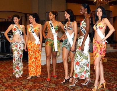 From left to right, Sandy Chua, Miss Singapore; Lindy Dehollander, Miss Belgium; Menaye Donkor, Miss Ghana; Laetitia Bleger, Miss France; Stacey-Ann Kelly, Miss Cayman Islands and Eri Machimoto, Miss Japan, pose for photographers at a hotel in Quito