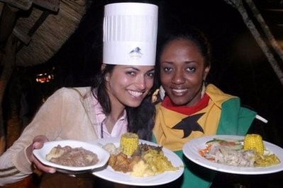 Miss India (left) and Miss Ghana hold plates of cultural food they cooked themselves, on November 24, at the Legend resort in Limpopo, in South Africa's northern province. In the Entabeni reserve, in the northwestern province of Limpopo, the 112 Miss World candidates left behind their on-stage personas to play enthusiastically on the djembe and plant a tree that bears their name