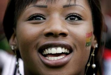 A supporters of Ghana's national soccer team celebrates during a public screening of the World Cup match against the Czech Republic, in front of Berlin's landmark Brandeburg Gate