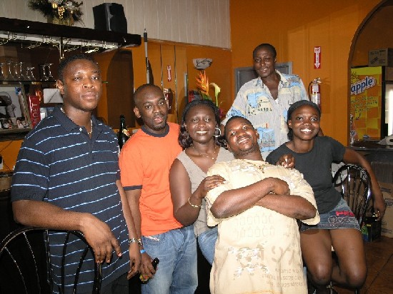 The customers at the restaurant were very happy to take a group picture with Nana Ama