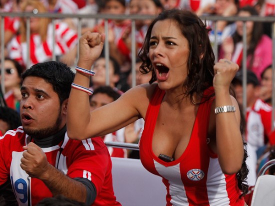 Soccer fans celebrate Paraguay making it to the next round of the South Africa 2010 WCup,