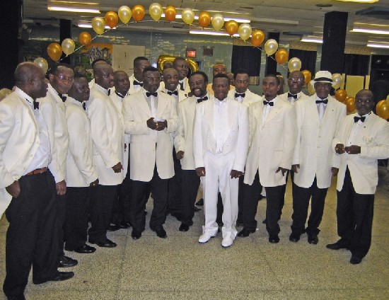 Mathias surrounded by members of the Ghanaian Gentlemen's Club