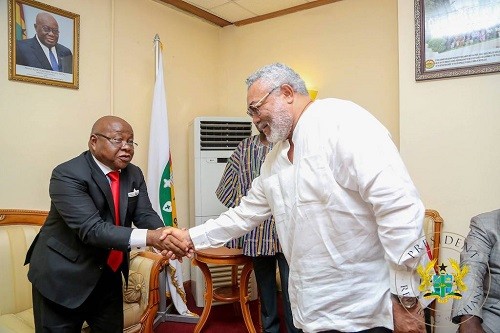 Former President Jerry John Rawlings and Speaker of Parliament Prof. Mike Ocquaye exchange handshake