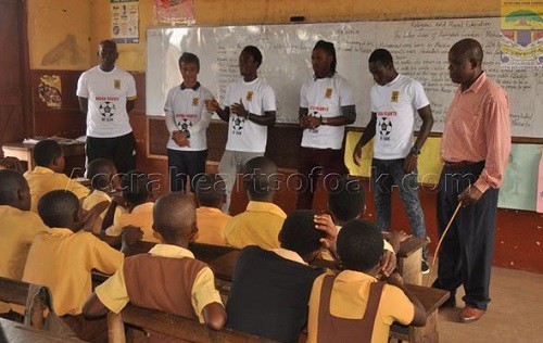 Some players of Hearts talking to the school kids