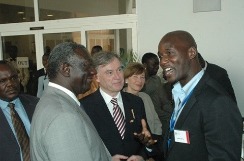 Former President Kufuor (left) in a chat with Tony Baffoe