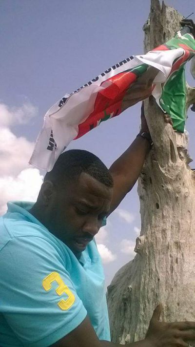 Dumelo spotted hanging NDC flag on a tree