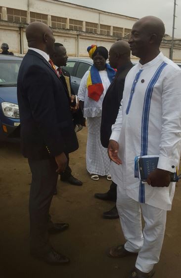 Some management members confer after the service