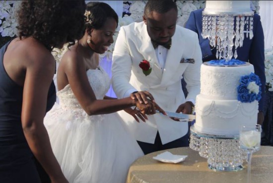 Bride and groom cuts cake