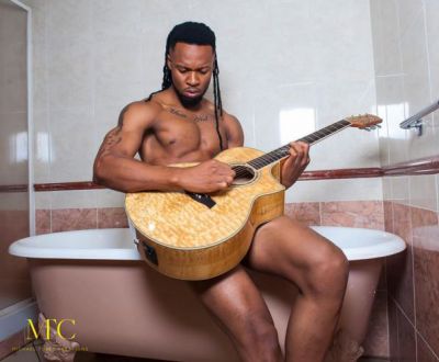 Flavour goes nude for his guitar in new photo