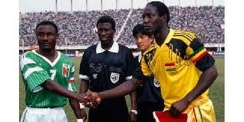 Tony Baffoe in handshake with Ivorian captain at the 1992 AFCON in Senegal