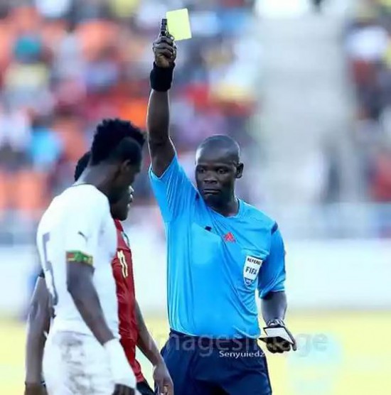 A Mozambican player booked after he hauled down John Boye (Photo Credit: Senyuiedzorm Awusi Adadevoh)