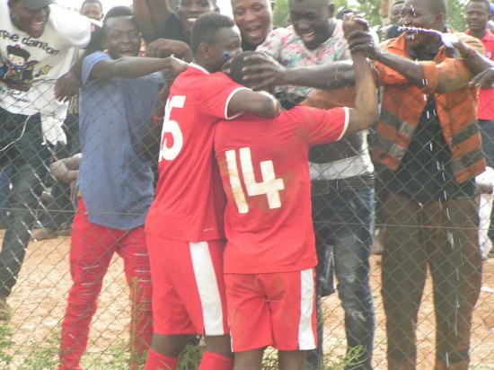 Supporters cheering Kenneth Mbah after the goal