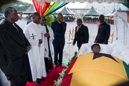 Members of th clergy pray for Madam Theodosia Okoh