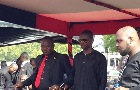 Donkor Fuseini (middle) standing on the dais