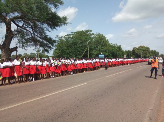 The students lined the highway in their numbers