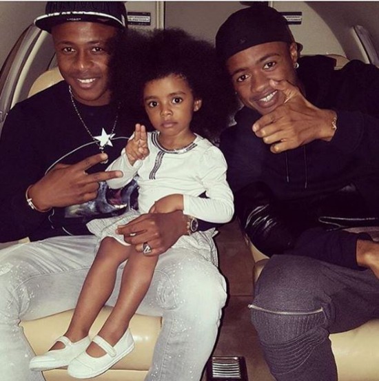 Dede Ayew with his brother Jordan and daughter