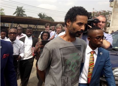 Arthur Simpson-Kent (2nd R), who is wanted over the murder of a former EastEnders actress and her two children, leaves a district court after a remand hearing in Accra, Ghana January 12, 2016. REUTERS/Matthew Bigg